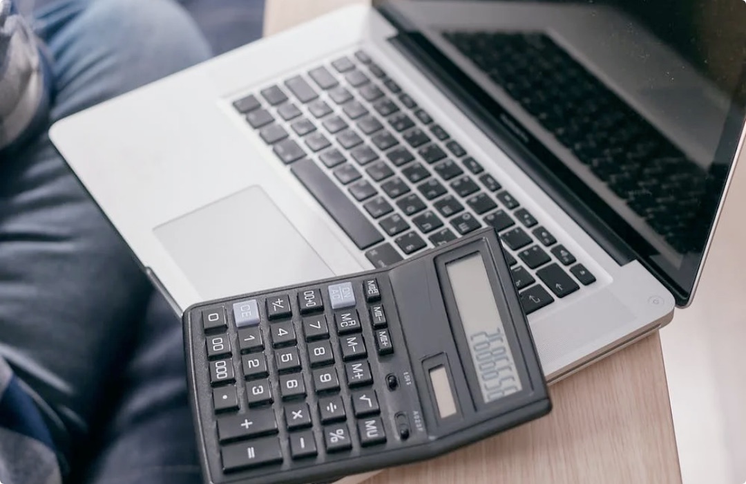 MacBook with calculator on top
